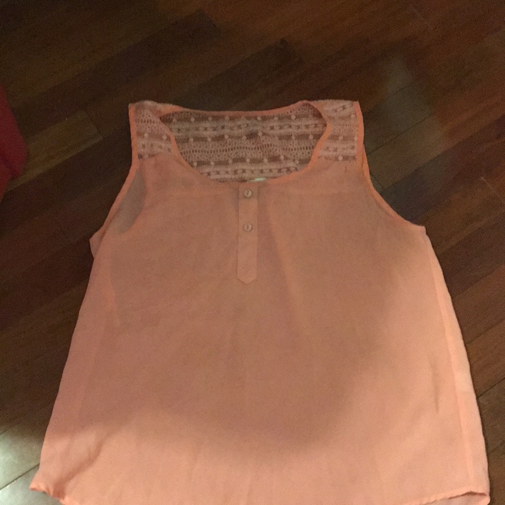 Peach tank top, with cute details in the back